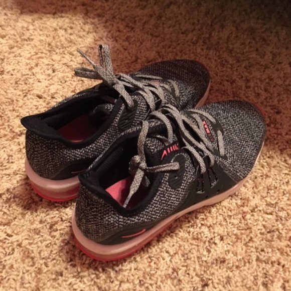 white nikes with pink soles